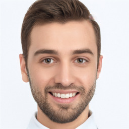 Joyful white young-adult male with short  brown hair and brown eyes