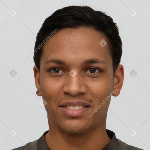 Joyful latino young-adult male with short  black hair and brown eyes