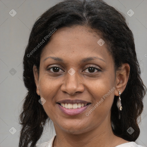 Joyful latino adult female with medium  brown hair and brown eyes