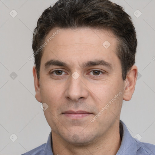 Joyful white adult male with short  brown hair and brown eyes