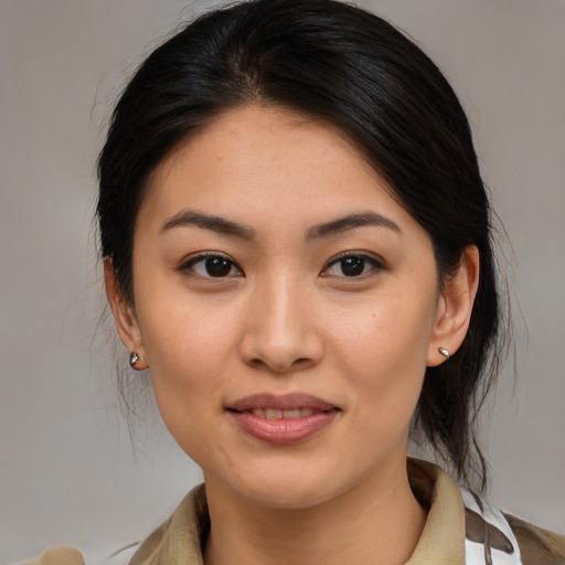 Joyful asian young-adult female with medium  brown hair and brown eyes