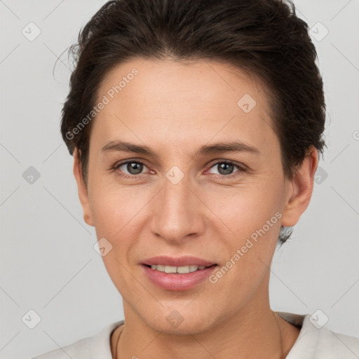 Joyful white adult female with short  brown hair and brown eyes