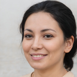 Joyful asian young-adult female with medium  brown hair and brown eyes