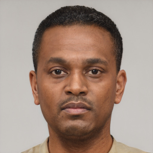 Neutral black young-adult male with short  black hair and brown eyes