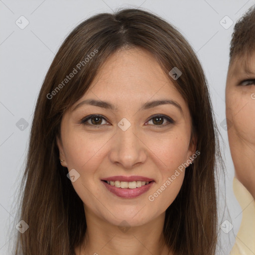 Joyful white young-adult female with long  brown hair and brown eyes