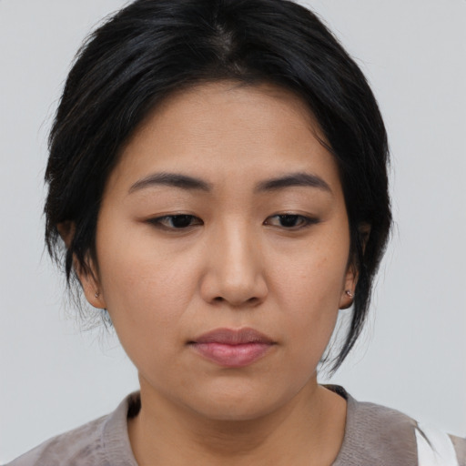 Neutral asian young-adult female with medium  black hair and brown eyes