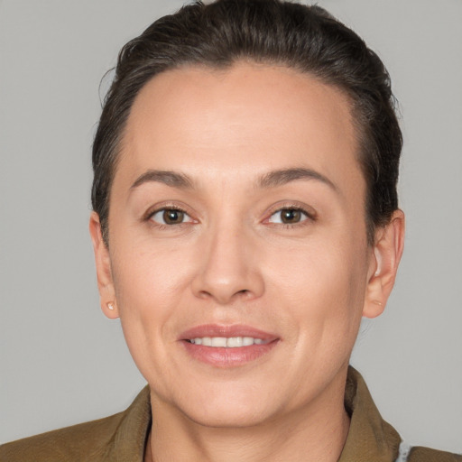 Joyful white adult female with short  brown hair and brown eyes