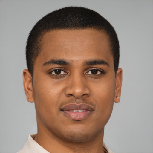 Joyful latino young-adult male with short  brown hair and brown eyes