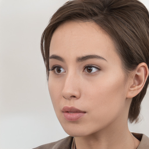 Neutral white young-adult female with medium  brown hair and brown eyes