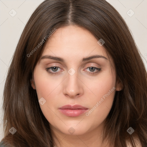 Neutral white young-adult female with long  brown hair and brown eyes