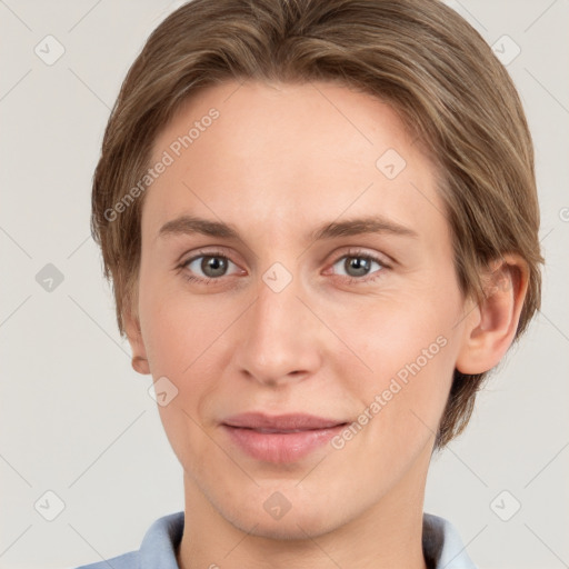 Joyful white young-adult female with short  brown hair and grey eyes