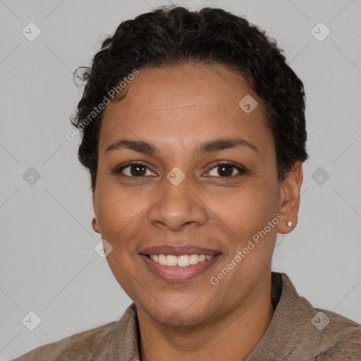 Joyful latino adult female with short  brown hair and brown eyes