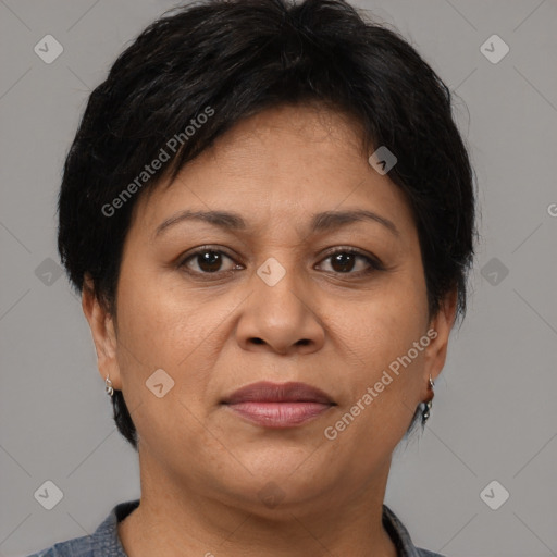 Joyful latino adult female with short  brown hair and brown eyes