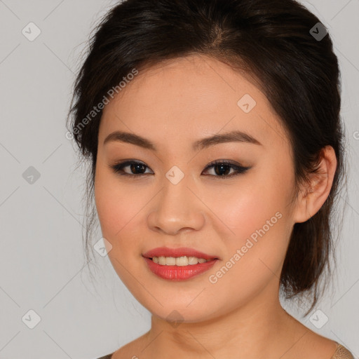 Joyful asian young-adult female with medium  brown hair and brown eyes