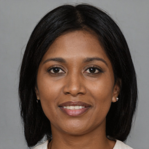 Joyful asian young-adult female with medium  black hair and brown eyes