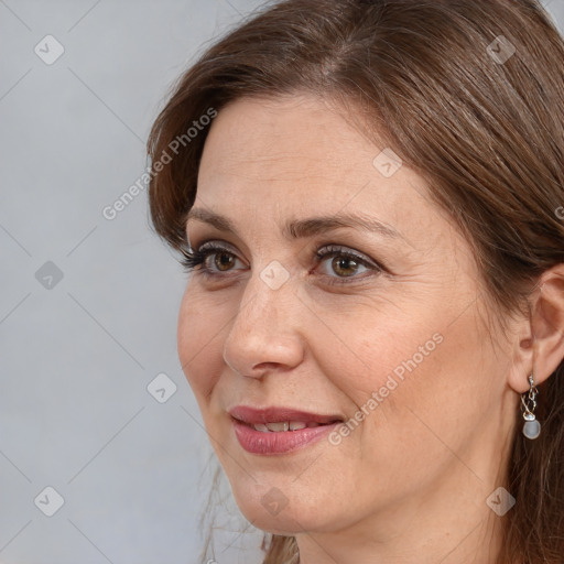 Joyful white adult female with medium  brown hair and grey eyes