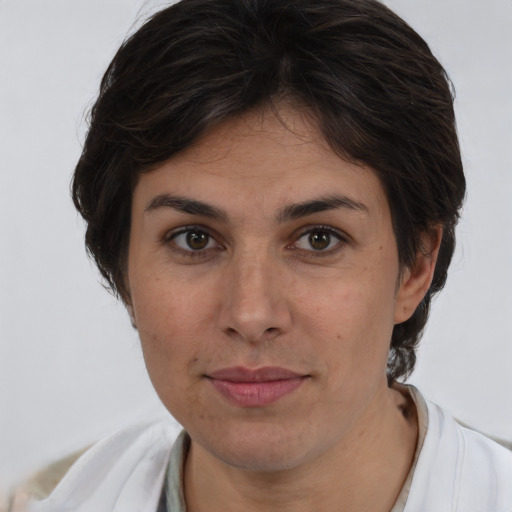 Joyful white adult female with short  brown hair and brown eyes