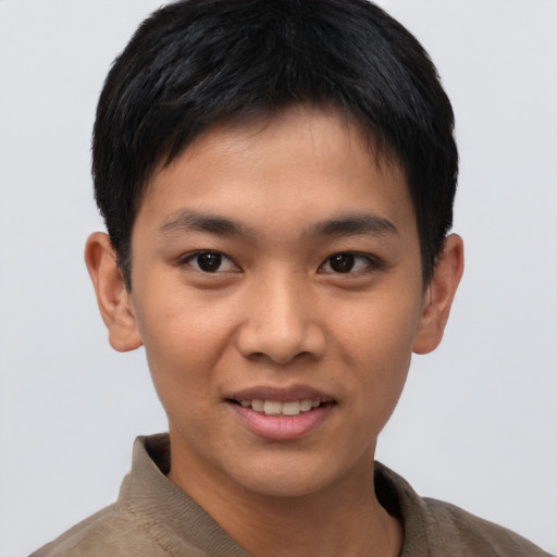 Joyful asian young-adult male with short  brown hair and brown eyes