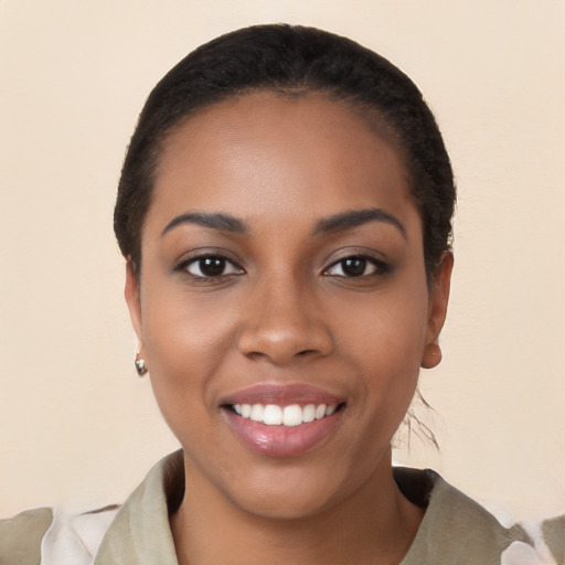 Joyful latino young-adult female with short  black hair and brown eyes