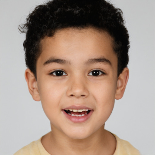 Joyful latino child male with short  brown hair and brown eyes