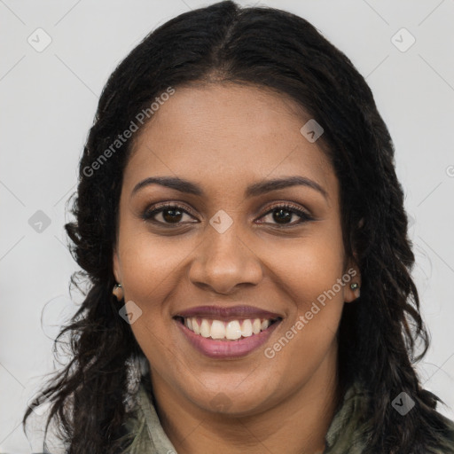 Joyful black young-adult female with long  brown hair and brown eyes