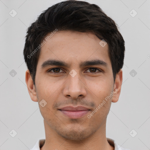 Joyful white young-adult male with short  black hair and brown eyes