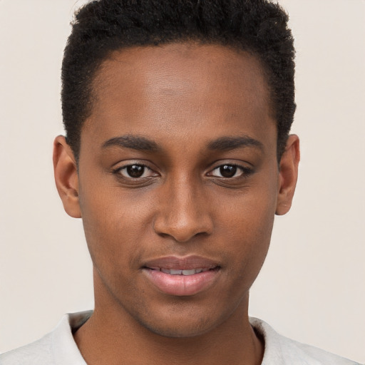 Joyful black young-adult male with short  brown hair and brown eyes