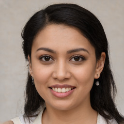 Joyful white young-adult female with medium  black hair and brown eyes