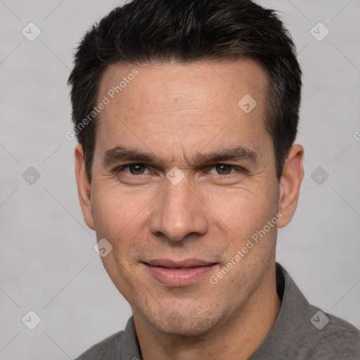 Joyful white adult male with short  brown hair and brown eyes