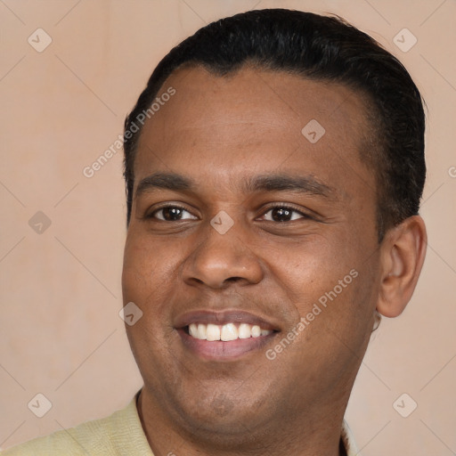 Joyful latino young-adult male with short  black hair and brown eyes