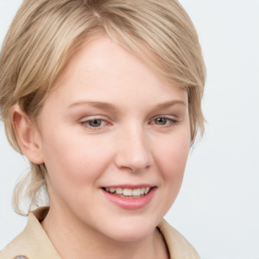 Joyful white young-adult female with medium  brown hair and blue eyes