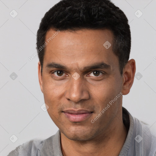 Joyful white young-adult male with short  black hair and brown eyes