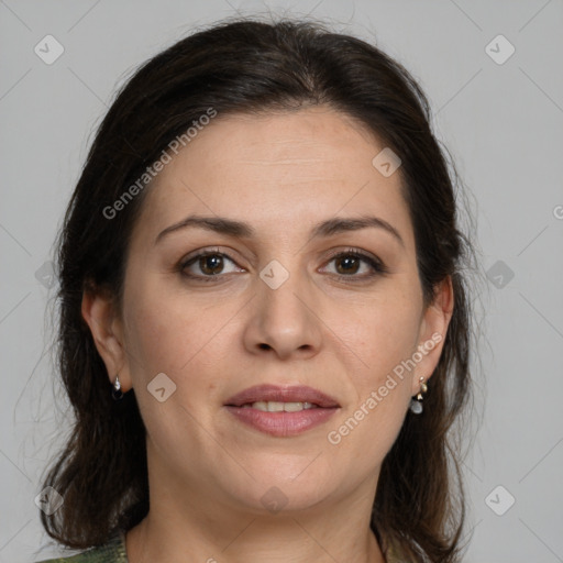 Joyful white adult female with medium  brown hair and brown eyes