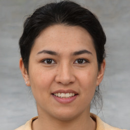 Joyful asian young-adult female with medium  brown hair and brown eyes