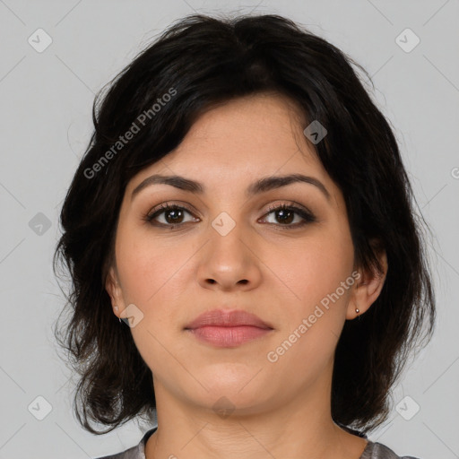 Joyful latino young-adult female with medium  black hair and brown eyes