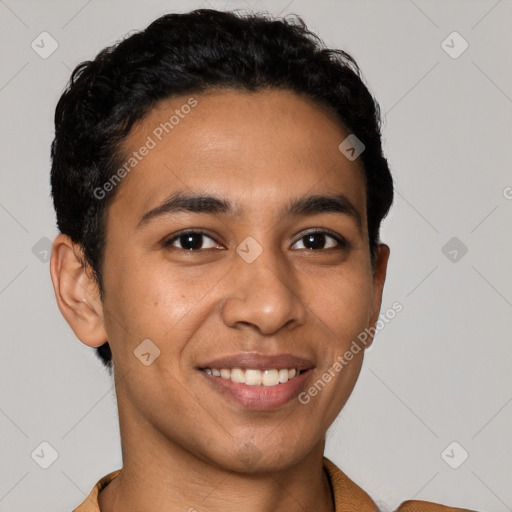 Joyful latino young-adult male with short  brown hair and brown eyes