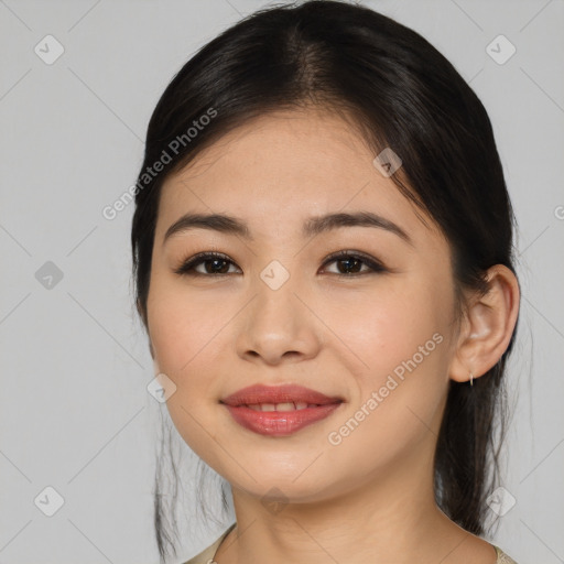 Joyful asian young-adult female with medium  brown hair and brown eyes