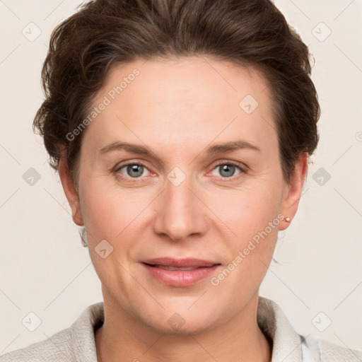 Joyful white adult female with short  brown hair and grey eyes