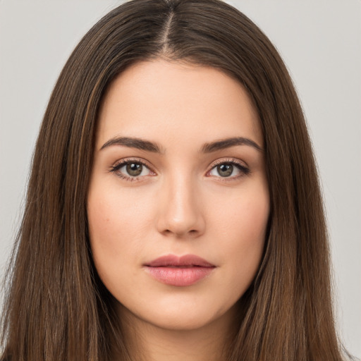 Neutral white young-adult female with long  brown hair and brown eyes