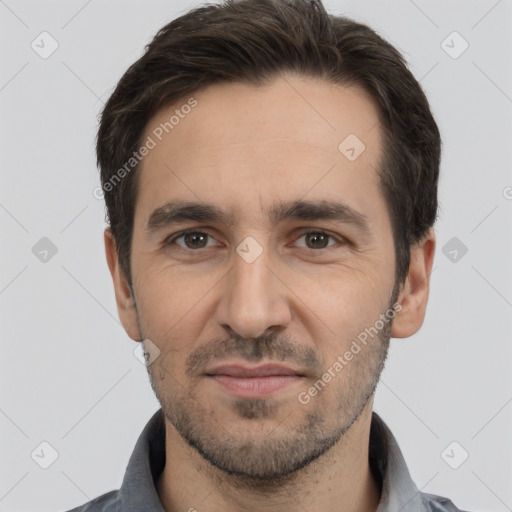 Joyful white young-adult male with short  black hair and brown eyes