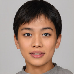 Joyful asian young-adult female with short  black hair and brown eyes