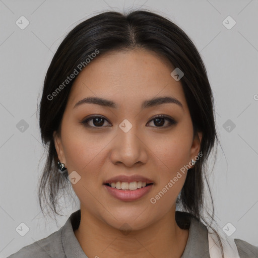 Joyful asian young-adult female with medium  black hair and brown eyes