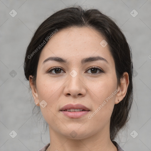 Joyful asian young-adult female with medium  brown hair and brown eyes