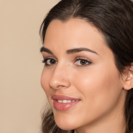 Joyful white young-adult female with medium  brown hair and brown eyes