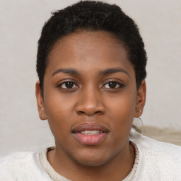 Joyful black young-adult female with short  brown hair and brown eyes