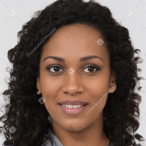 Joyful black young-adult female with long  brown hair and brown eyes