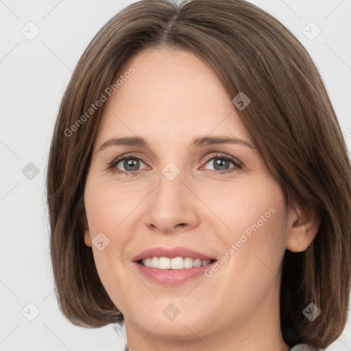 Joyful white young-adult female with medium  brown hair and green eyes