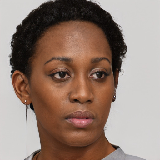 Neutral black young-adult female with short  brown hair and brown eyes