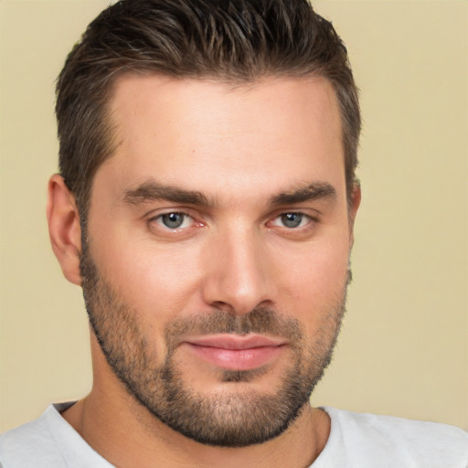 Joyful white young-adult male with short  brown hair and brown eyes