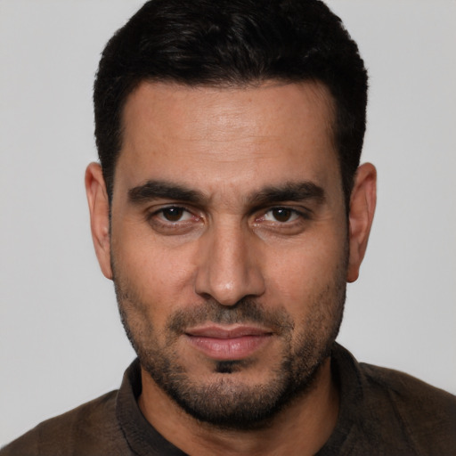 Neutral white young-adult male with short  black hair and brown eyes